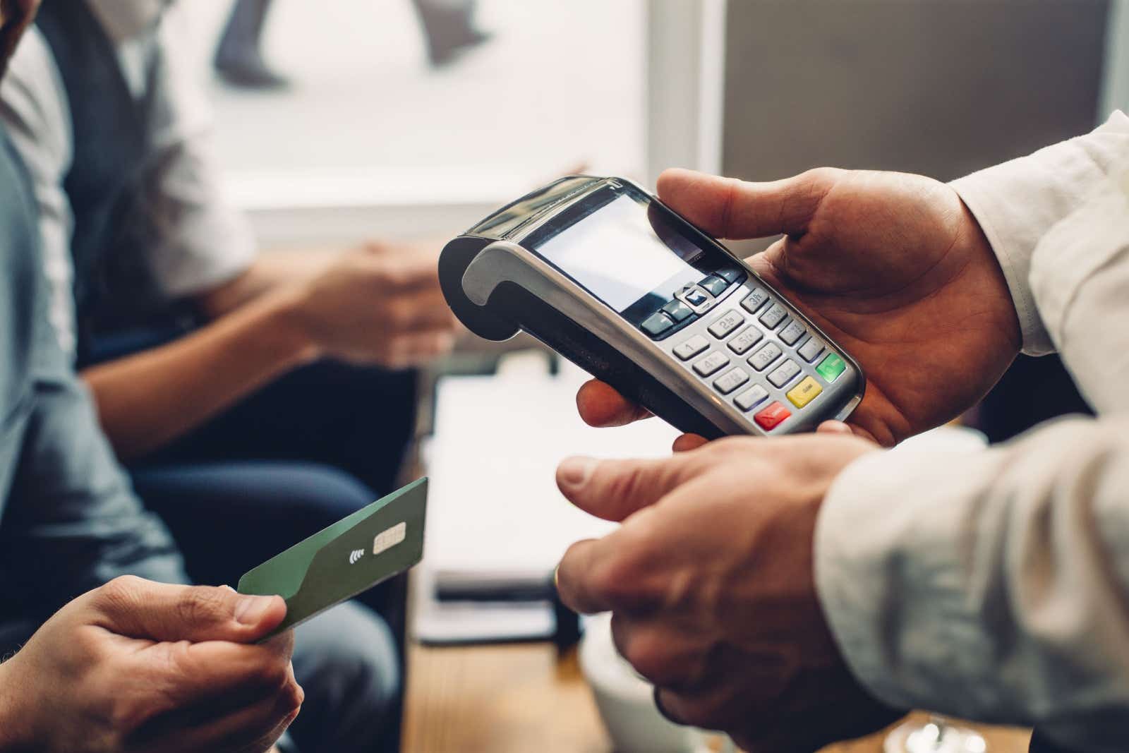 People using a card machine