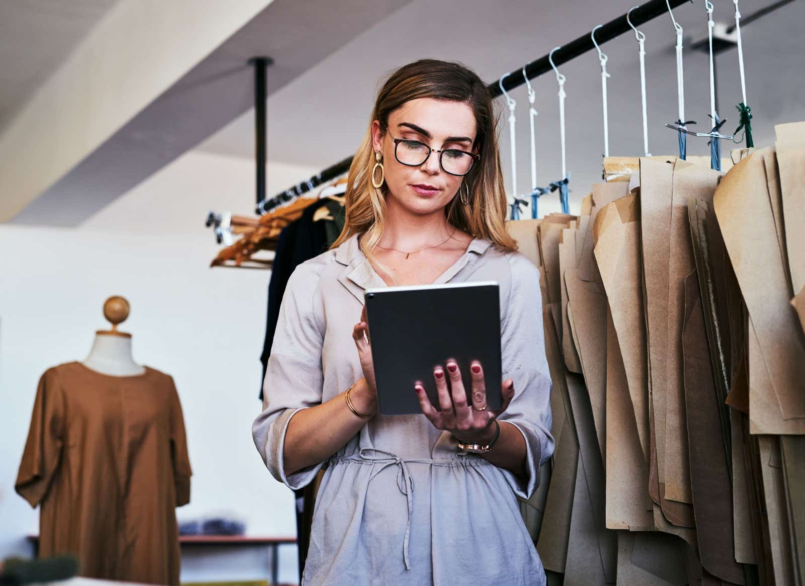 Entrepreneur checking orders on her tablet